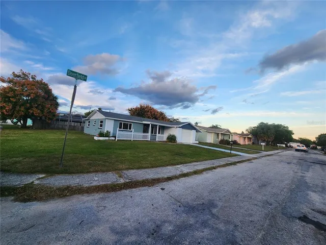 a view of a house next to a yard