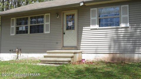 1073 State Road Effort, PA 18330 - Photo 4 of 10 a front view of a house with a yard
