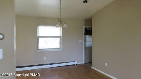 1073 State Road Effort, PA 18330 - Photo 9 of 10 a view of an empty room with wooden floor and a window
