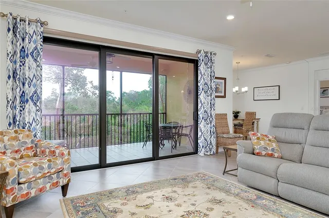 a kitchen with stainless steel appliances granite countertop a sink a microwave a refrigerator and cabinets