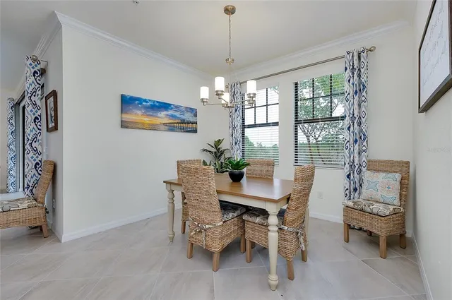 a bedroom with a bed mirror and a window