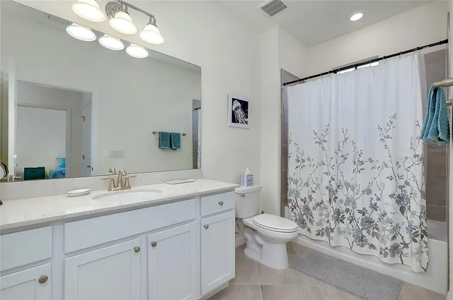 a living room with lots of furniture and a chandelier