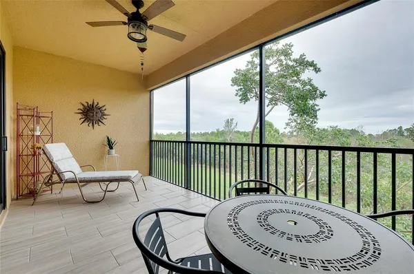 a view of swimming pool with outdoor seating