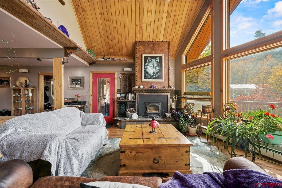 87 Which Way Ridgway, CO 81432 - Photo 11 of 45 a living room with furniture and a fireplace