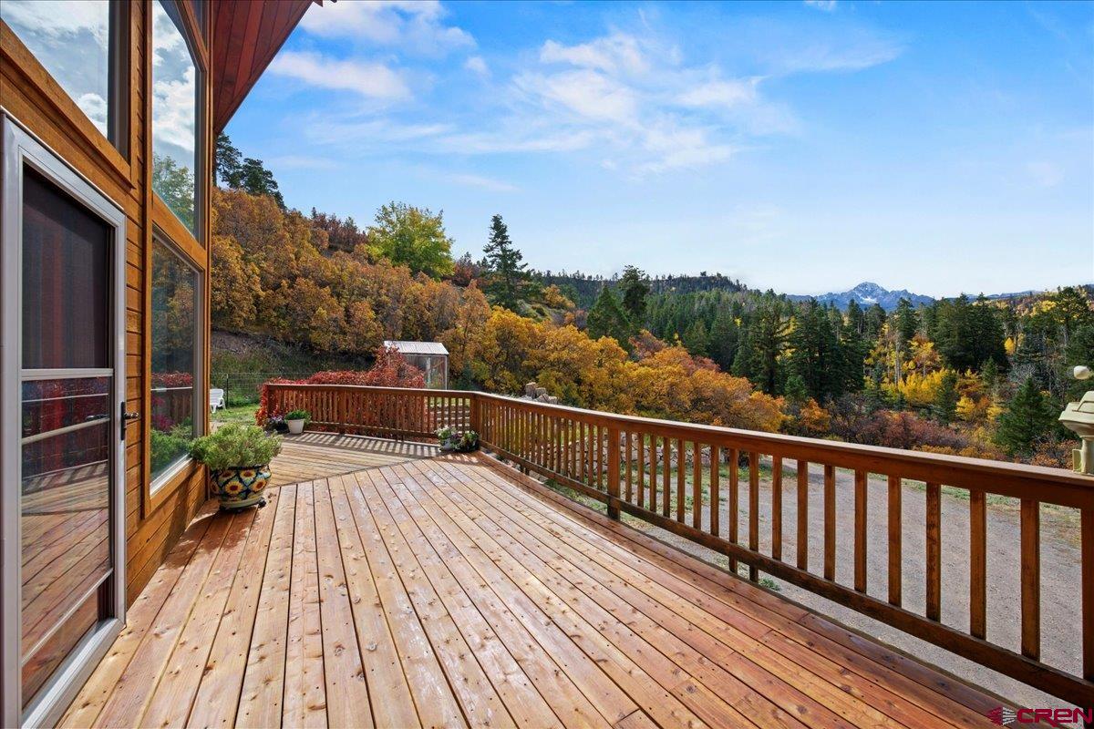 87 Which Way Ridgway, CO 81432 - Photo 14 of 45 a view of balcony with wooden floor and fence