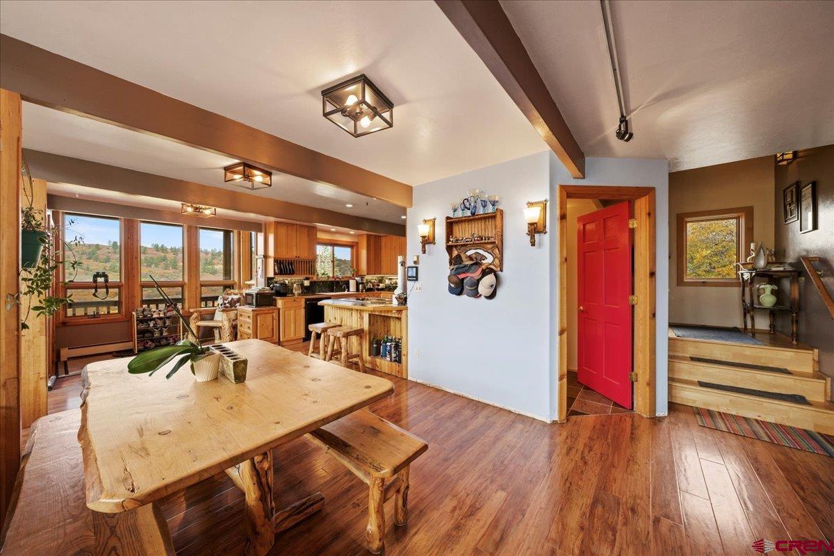 87 Which Way Ridgway, CO 81432 - Photo 22 of 45 a view of a dining room with furniture a kitchen and chandelier