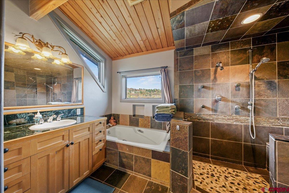 87 Which Way Ridgway, CO 81432 - Photo 26 of 45 a bathroom with a sink and mirror