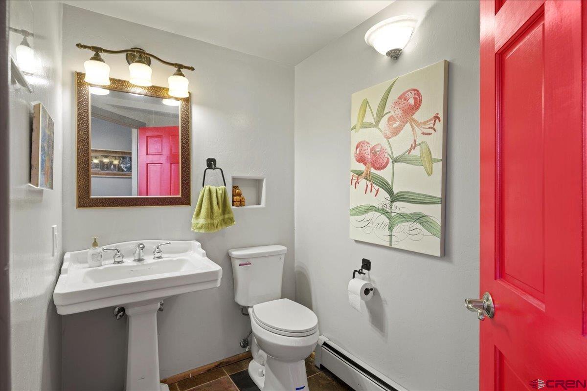 87 Which Way Ridgway, CO 81432 - Photo 31 of 45 a bathroom with a sink mirror vanity and toilet