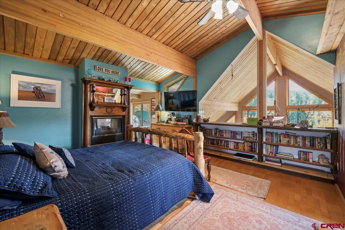 87 Which Way Ridgway, CO 81432 - Photo 33 of 45 a bedroom with furniture and a large window