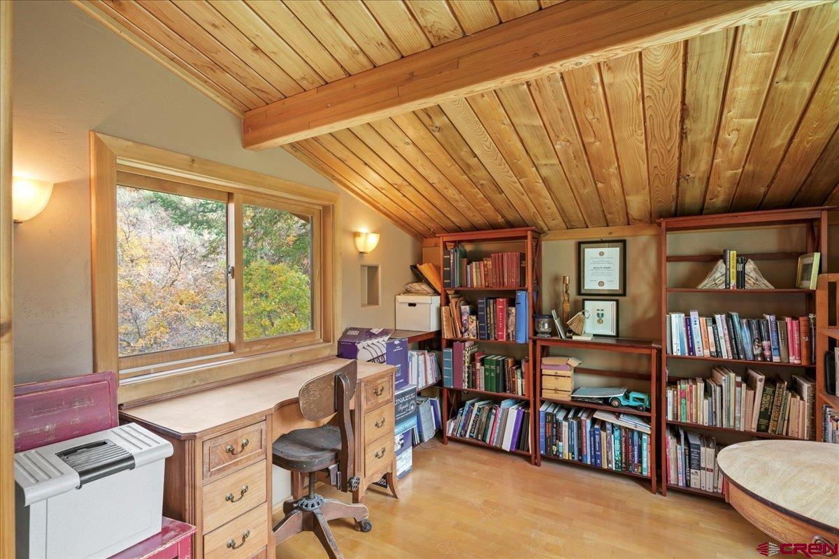 87 Which Way Ridgway, CO 81432 - Photo 37 of 45 a view of a livingroom with furniture and a bookshelf