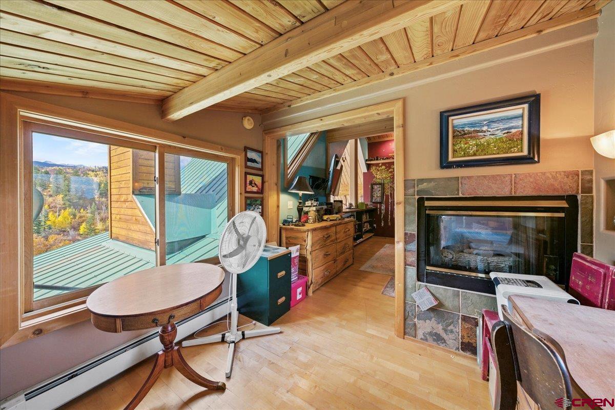 87 Which Way Ridgway, CO 81432 - Photo 38 of 45 a living room with furniture a fireplace and a table