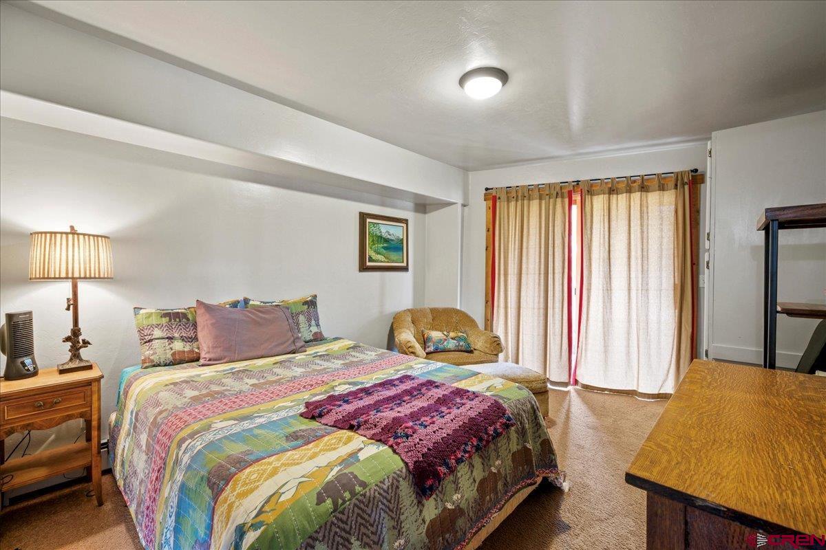 87 Which Way Ridgway, CO 81432 - Photo 44 of 45 a bedroom with a bed and a window