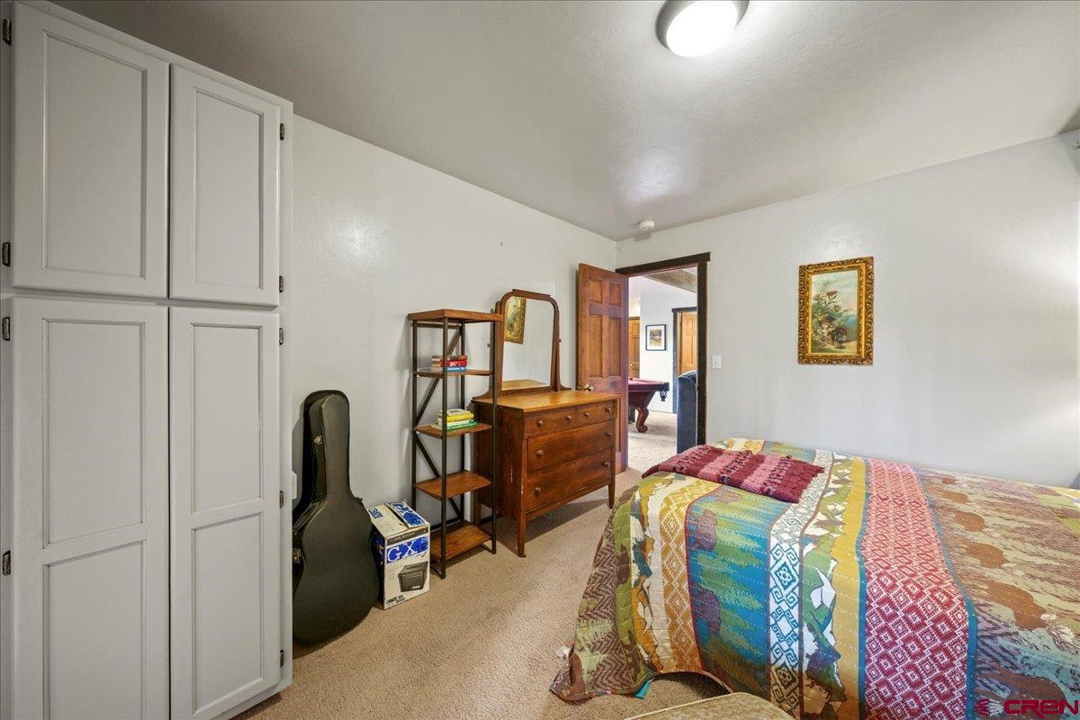 87 Which Way Ridgway, CO 81432 - Photo 45 of 45 a bedroom with bed and a window