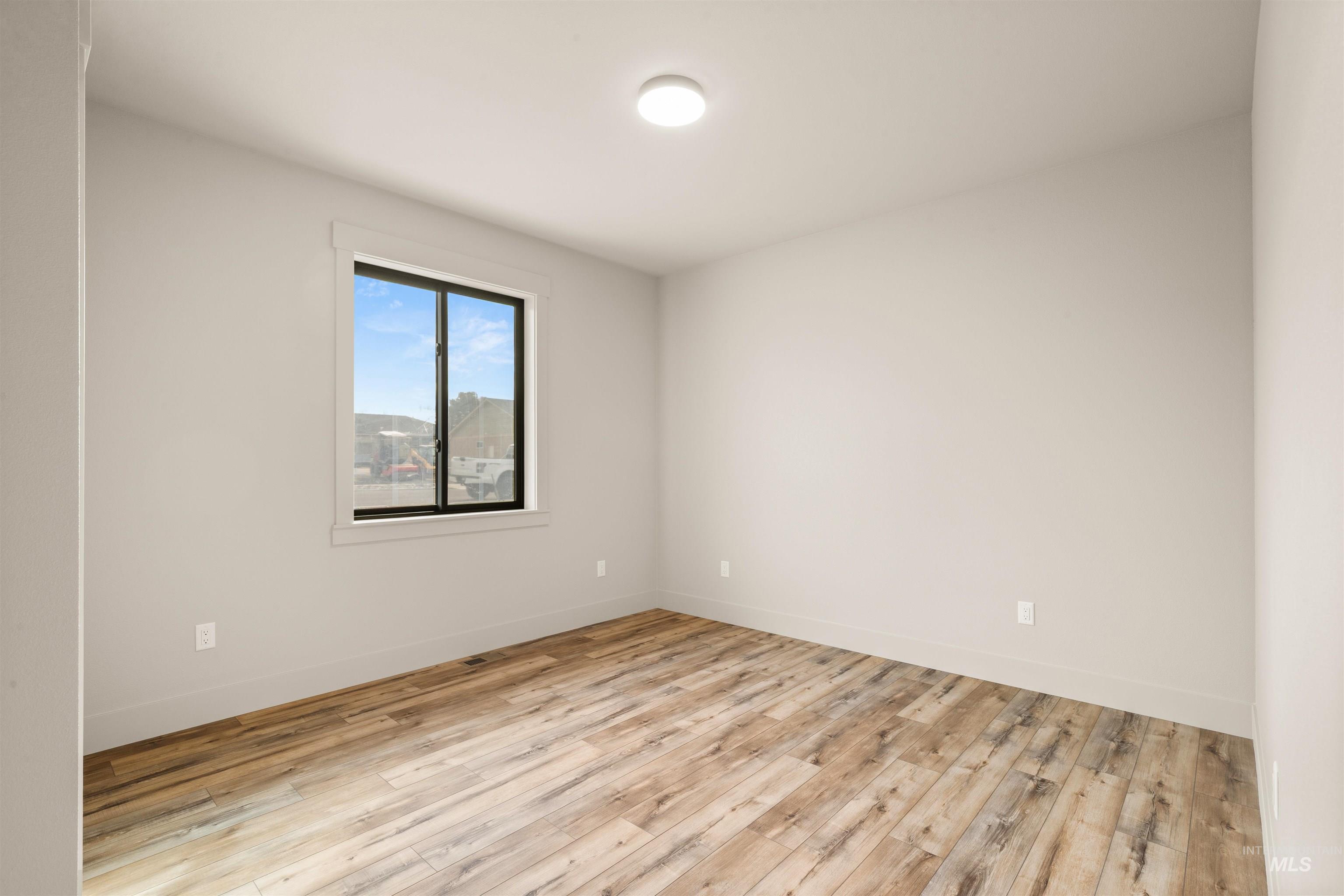 335 Warner Avenue Lewiston, ID 83501 - Photo 35 of 43 Unfurnished room featuring light wood finished floors and baseboards
