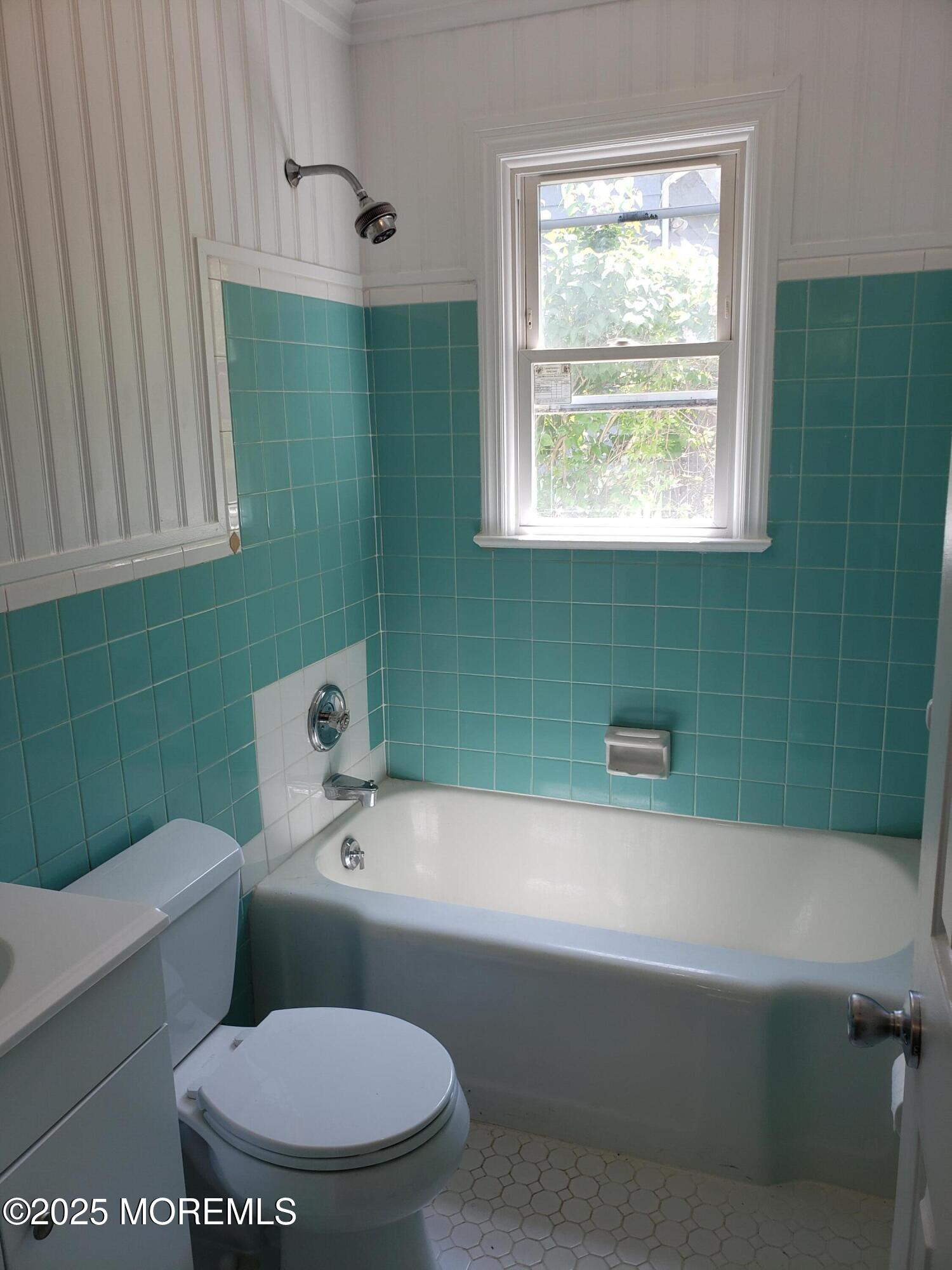 158 Monmouth Road Oakhurst, NJ 07755 - Photo 15 of 19 a bathroom with a toilet sink and mirror