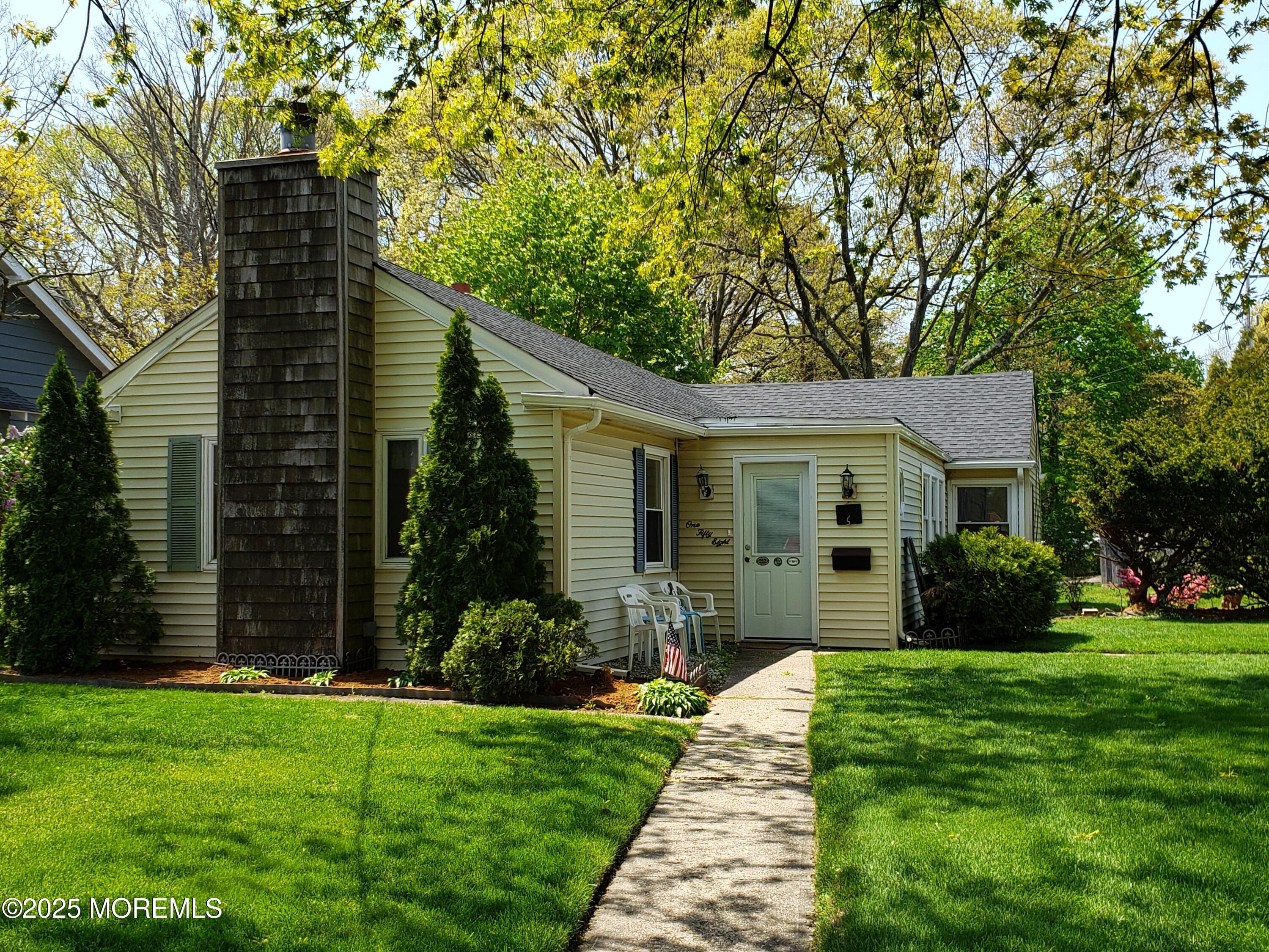 158 Monmouth Road Oakhurst, NJ 07755 - Photo 17 of 19 a view of a house with a yard