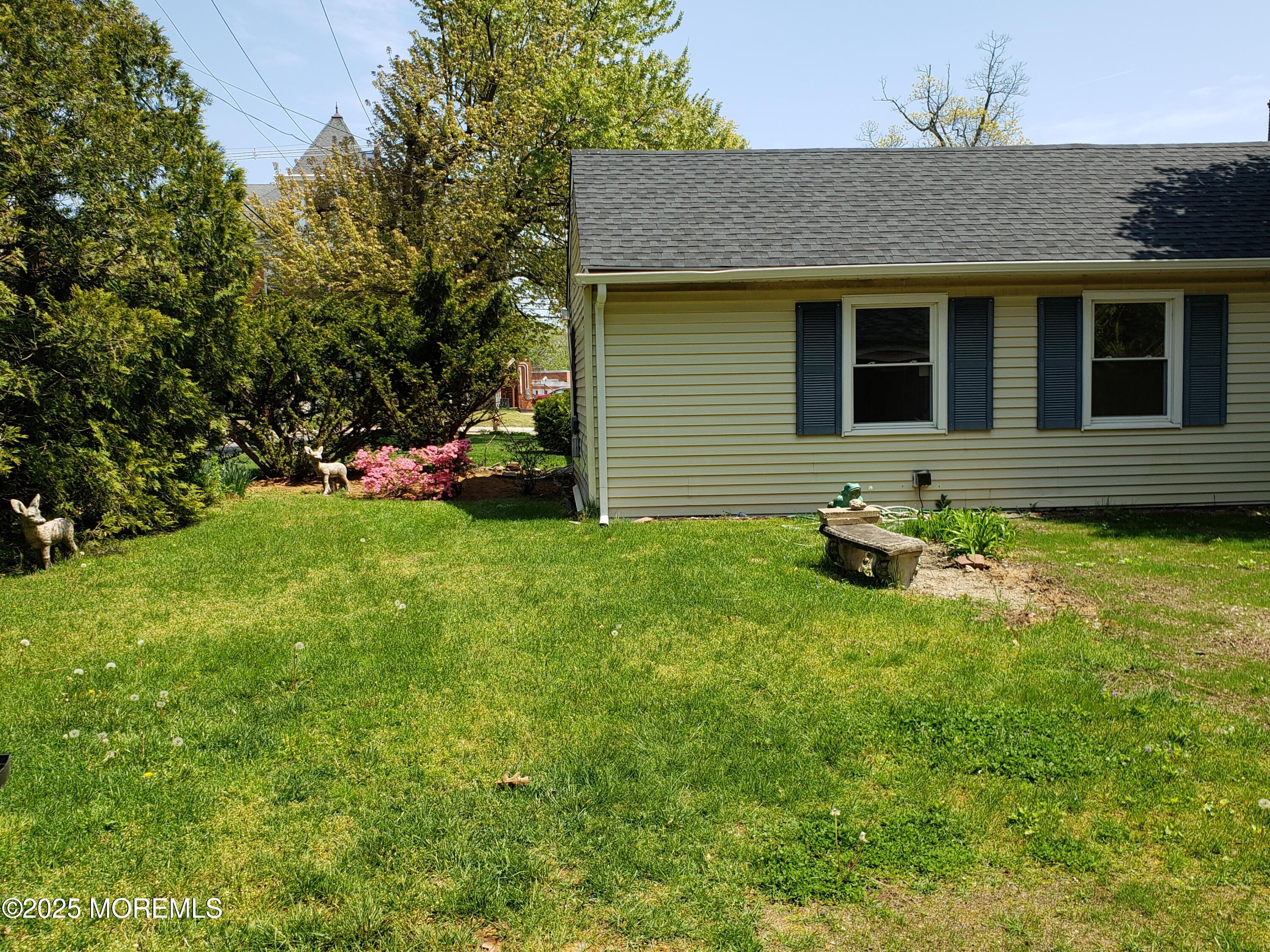 158 Monmouth Road Oakhurst, NJ 07755 - Photo 18 of 19 a view of a house with a backyard