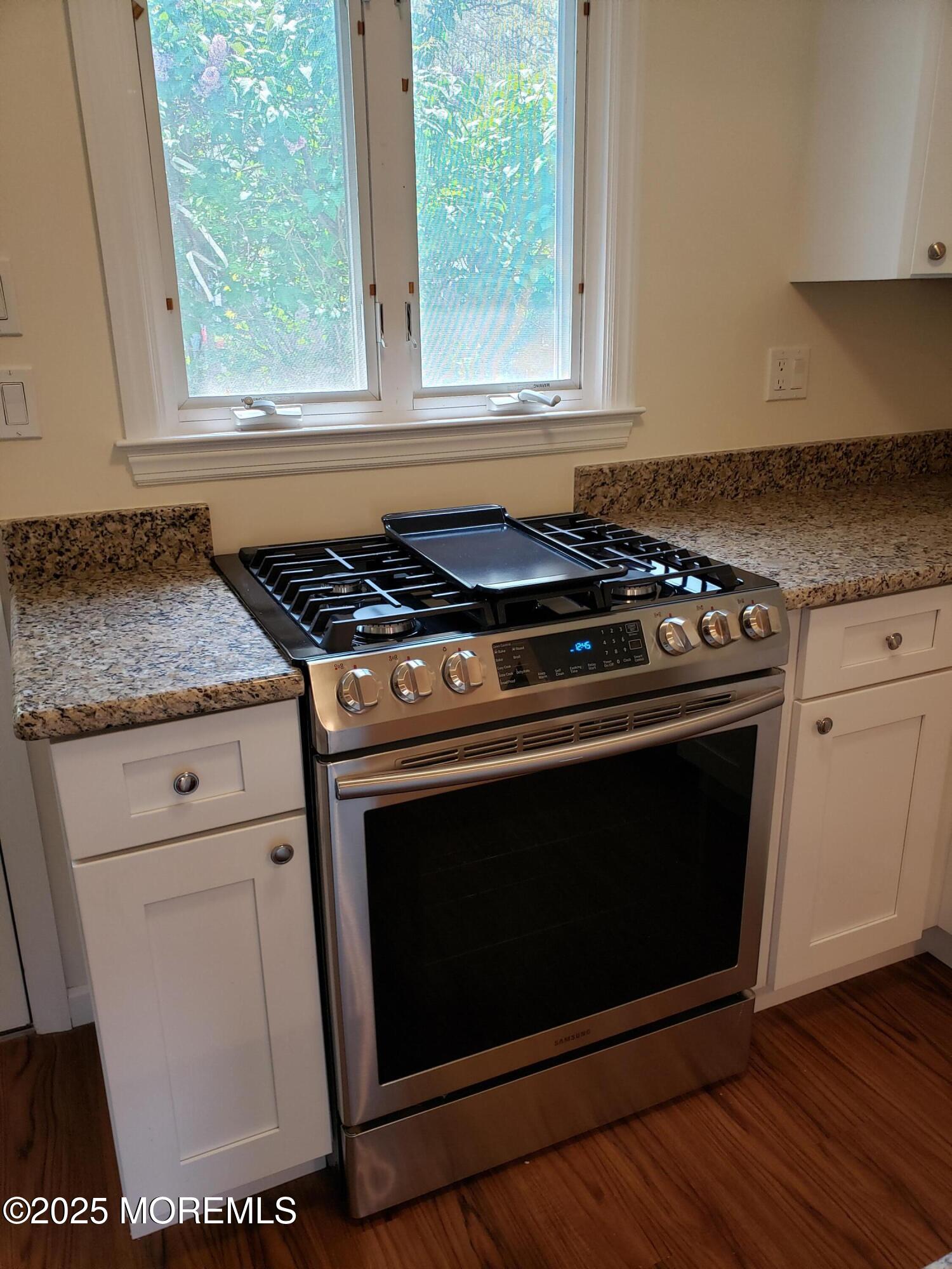 158 Monmouth Road Oakhurst, NJ 07755 - Photo 5 of 19 a stove top oven sitting inside of a kitchen