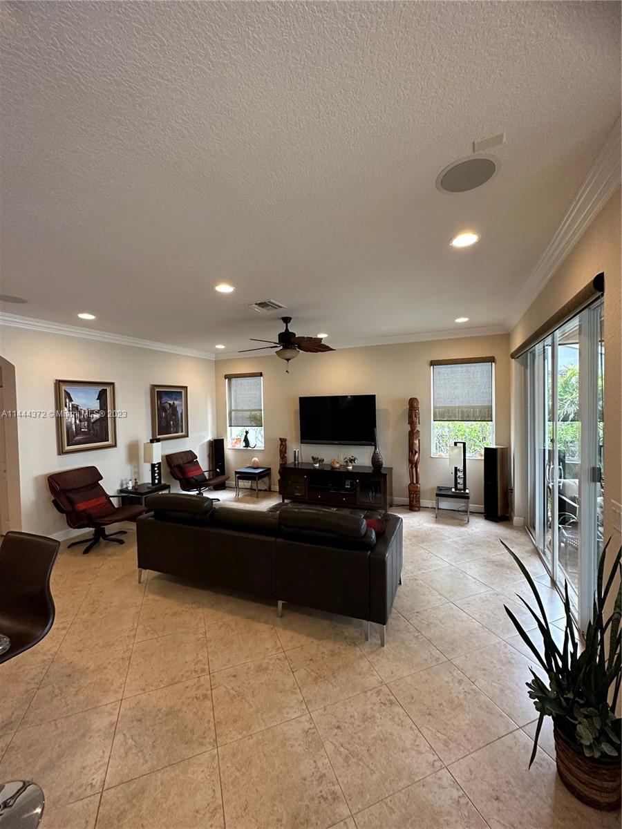 4546 Southwest 179th Way Miramar, FL 33029 - Photo 11 of 55 a living room with furniture and a flat screen tv