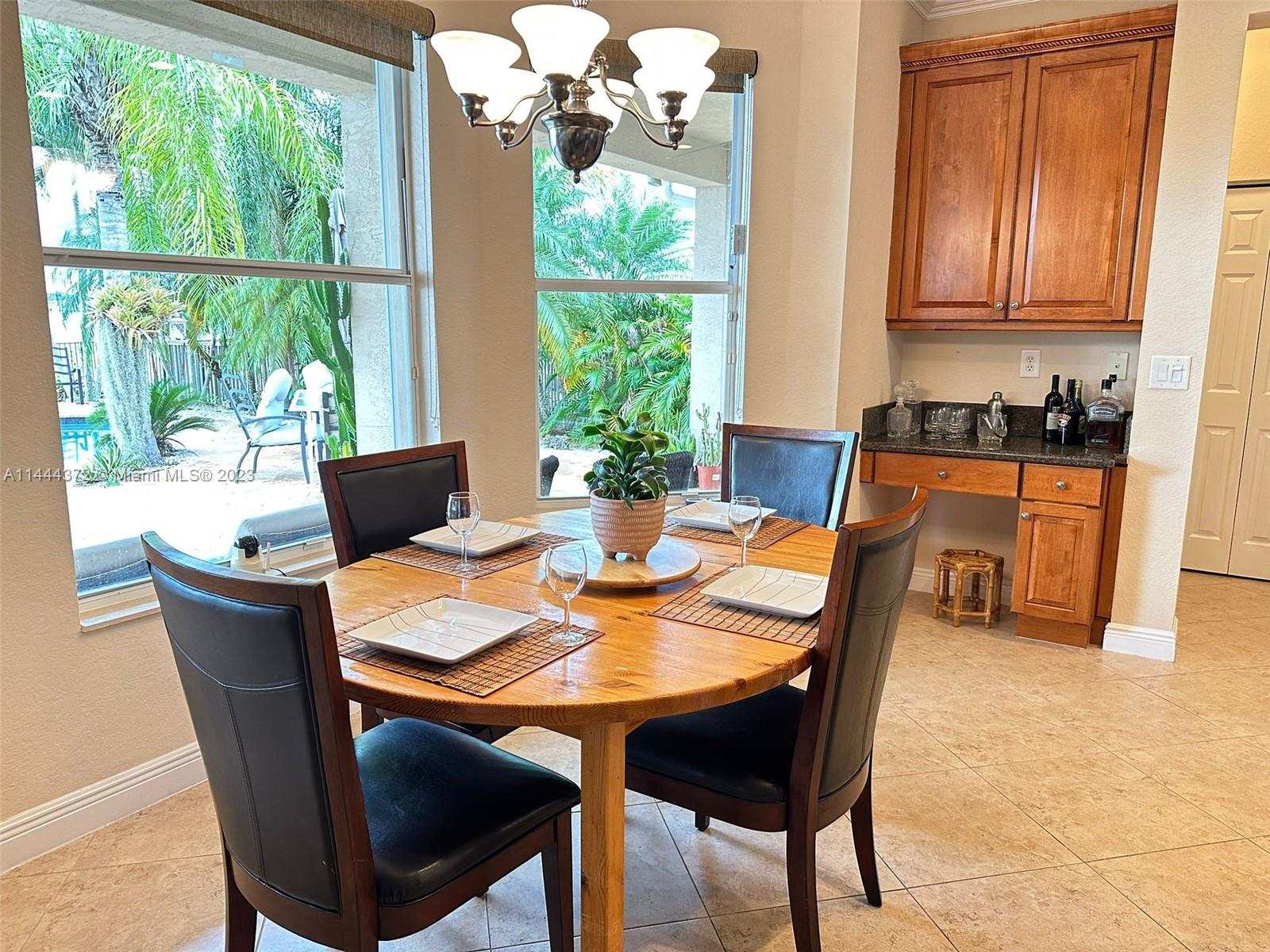 4546 Southwest 179th Way Miramar, FL 33029 - Photo 15 of 55 a view of a dining room with furniture window and outside view