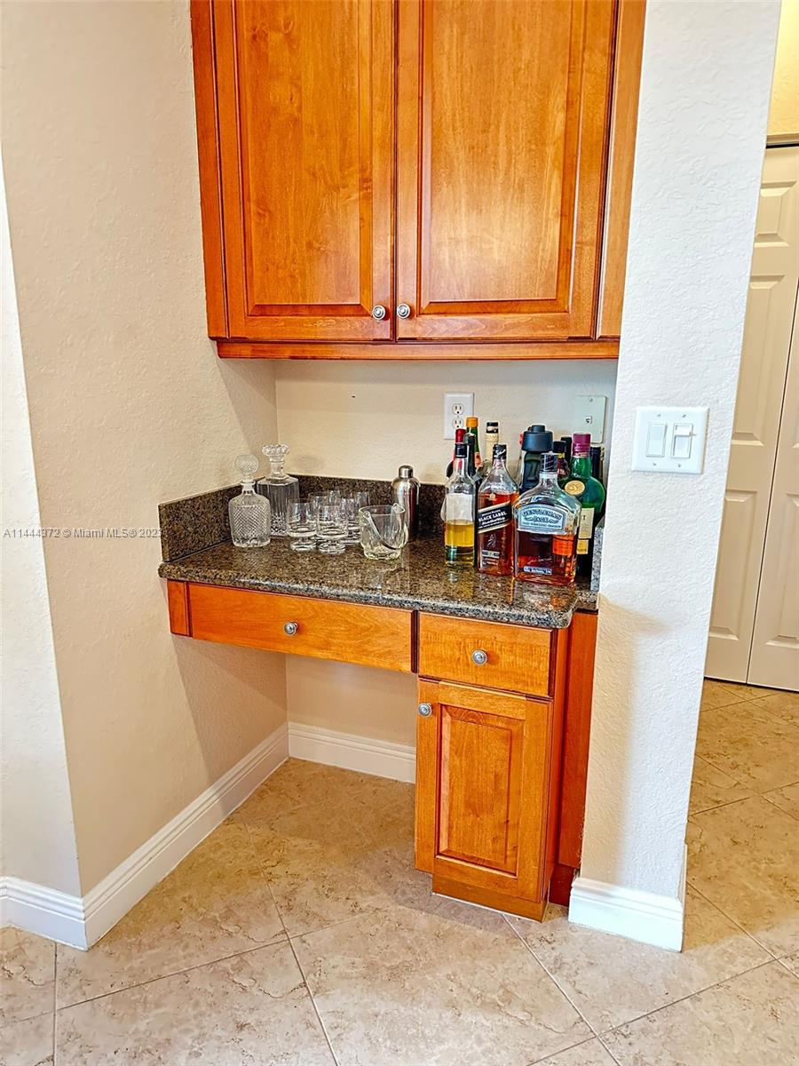 4546 Southwest 179th Way Miramar, FL 33029 - Photo 16 of 55 a kitchen with stainless steel appliances granite countertop a refrigerator a stove a sink and dishwasher
