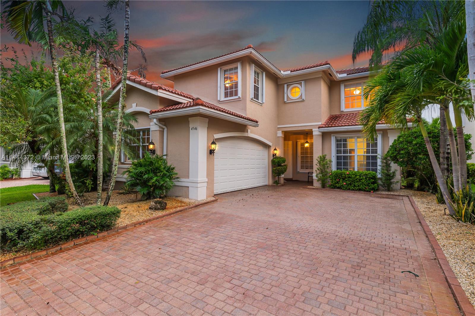 4546 Southwest 179th Way Miramar, FL 33029 - Photo 2 of 55 a front view of a house with a yard and garage