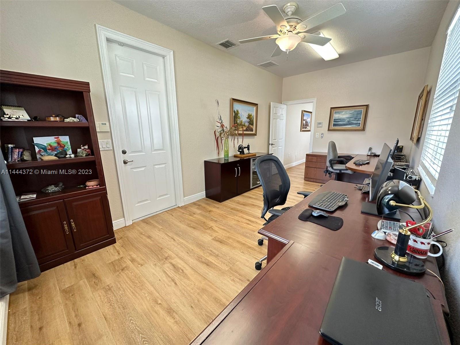 4546 Southwest 179th Way Miramar, FL 33029 - Photo 22 of 55 a bedroom with bed and wooden floor