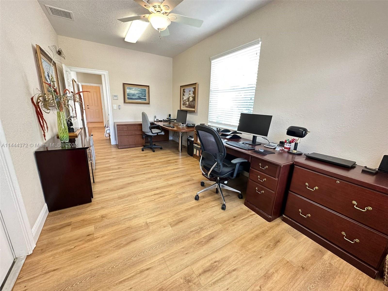 4546 Southwest 179th Way Miramar, FL 33029 - Photo 23 of 55 a view of a workspace with furniture and a window