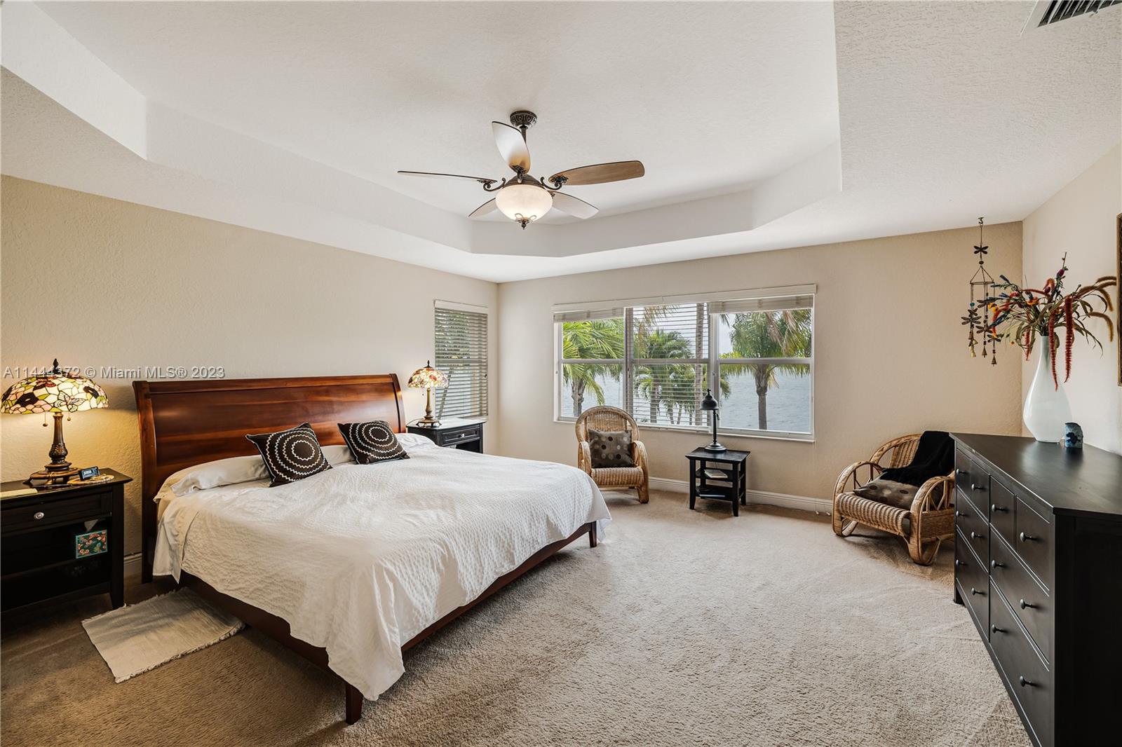 4546 Southwest 179th Way Miramar, FL 33029 - Photo 25 of 55 a bedroom with a bed and a chandelier