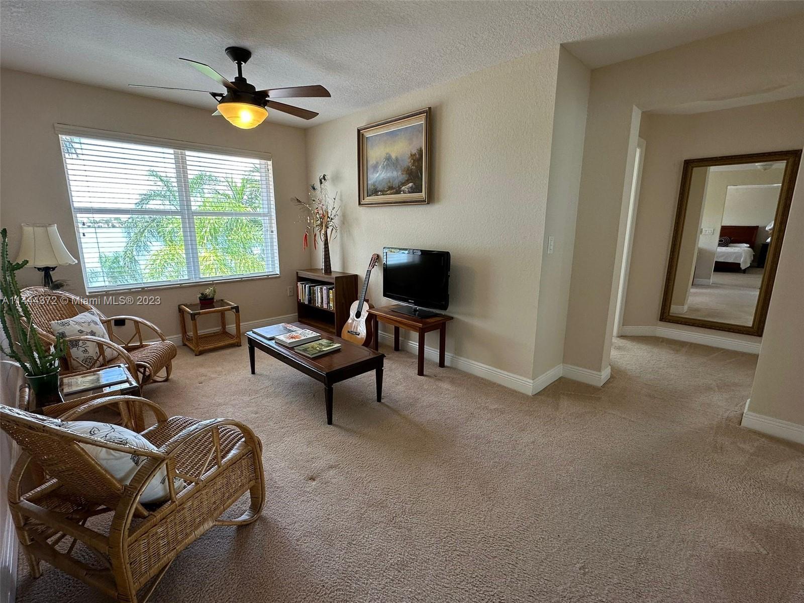 4546 Southwest 179th Way Miramar, FL 33029 - Photo 28 of 55 a living room with furniture and a large window