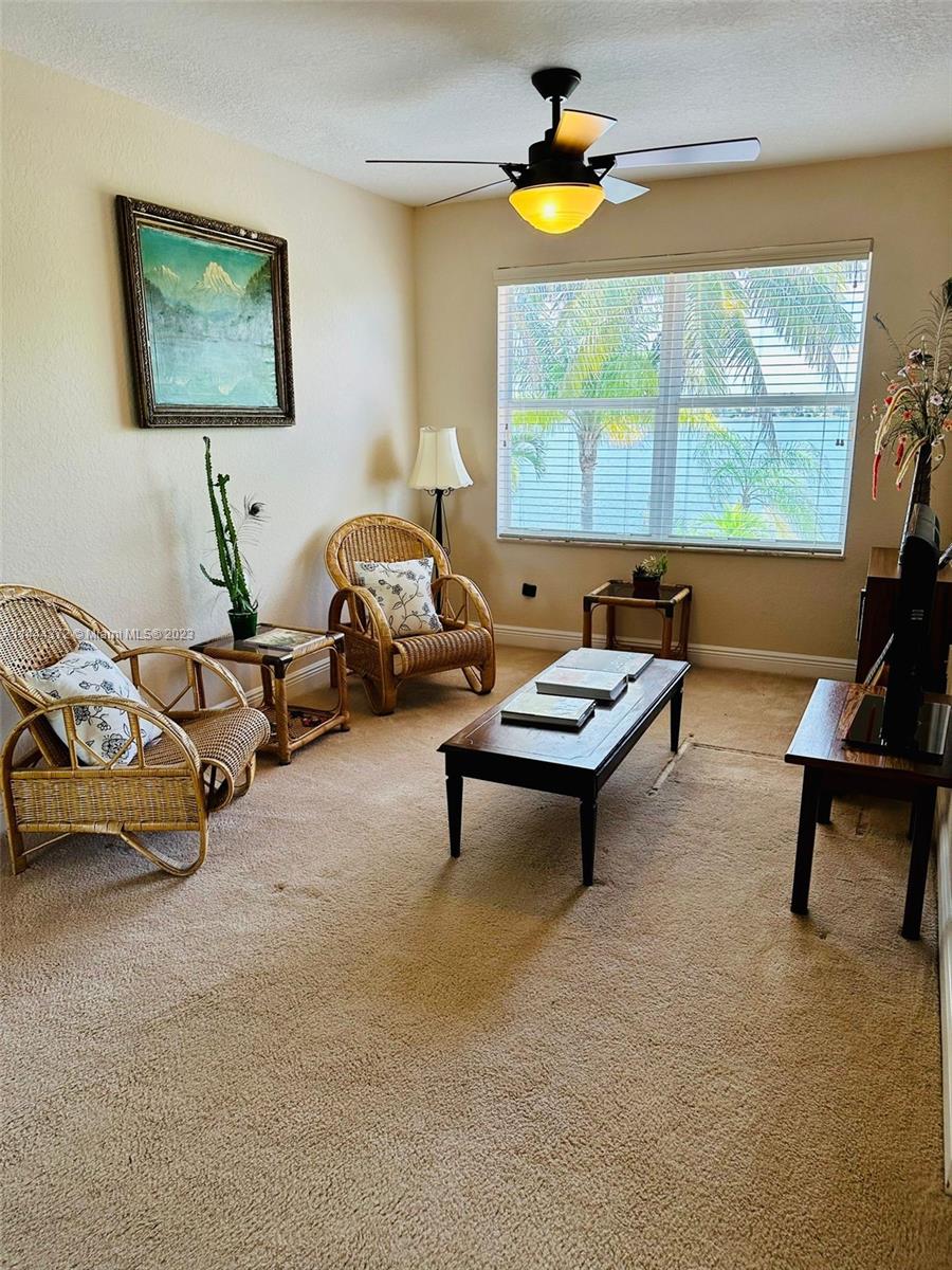 4546 Southwest 179th Way Miramar, FL 33029 - Photo 29 of 55 a living room with furniture and a window