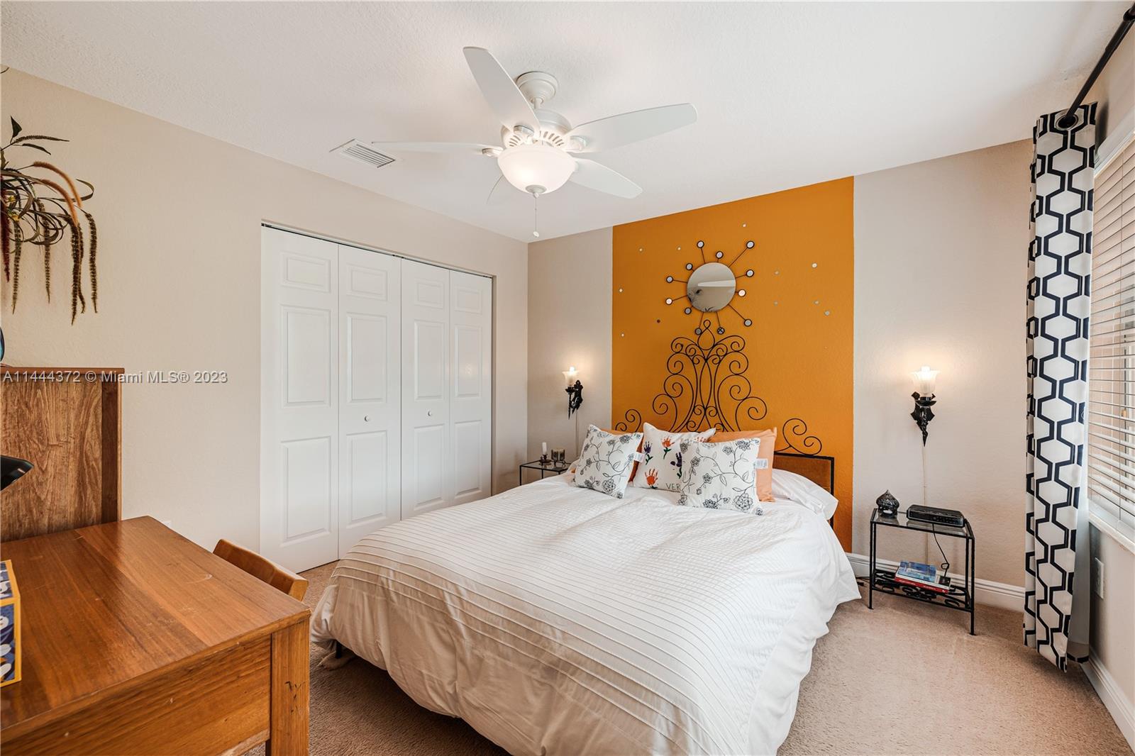 4546 Southwest 179th Way Miramar, FL 33029 - Photo 39 of 55 a bedroom with a bed and a chandelier