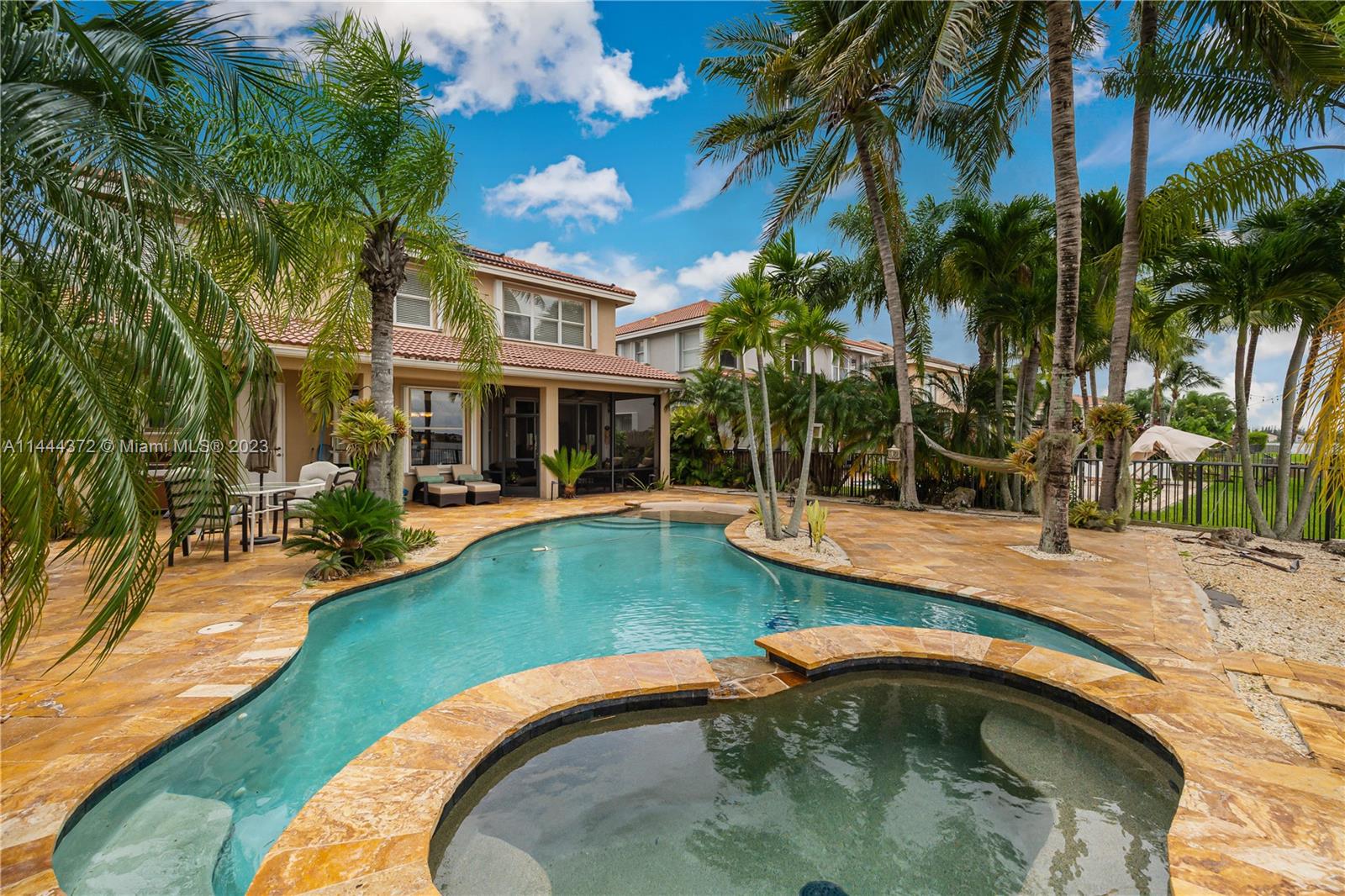 4546 Southwest 179th Way Miramar, FL 33029 - Photo 41 of 55 a view of a swimming pool with a patio