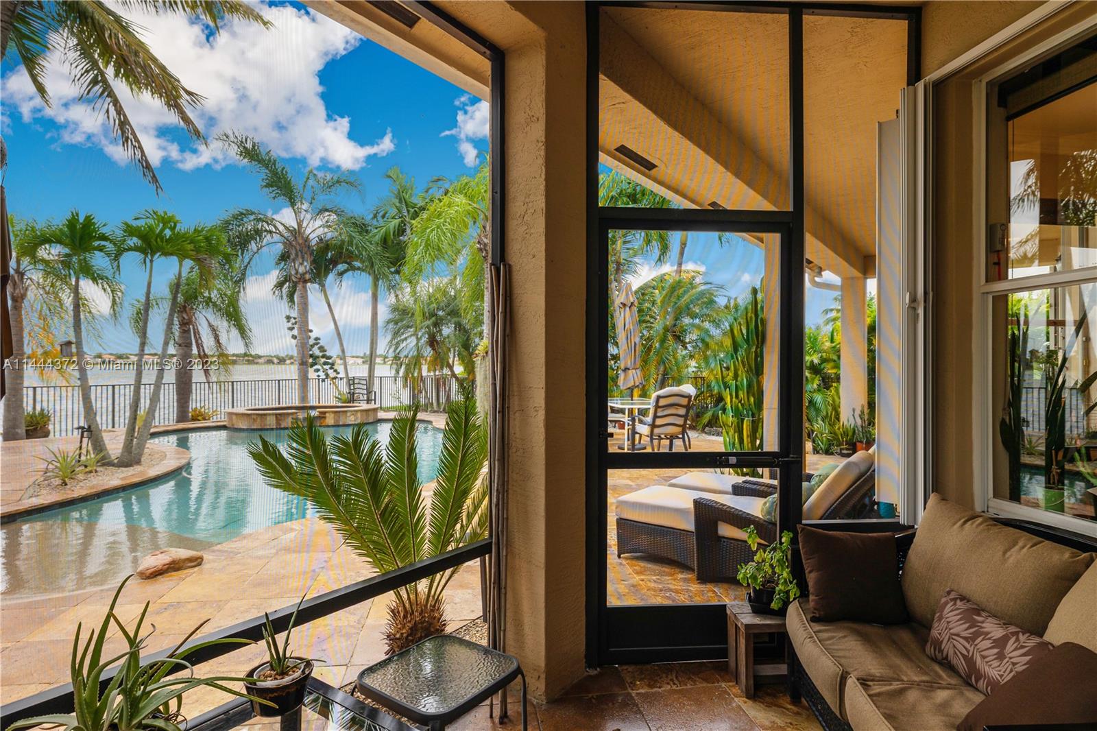 4546 Southwest 179th Way Miramar, FL 33029 - Photo 44 of 55 a view of a balcony with chairs and a potted plant