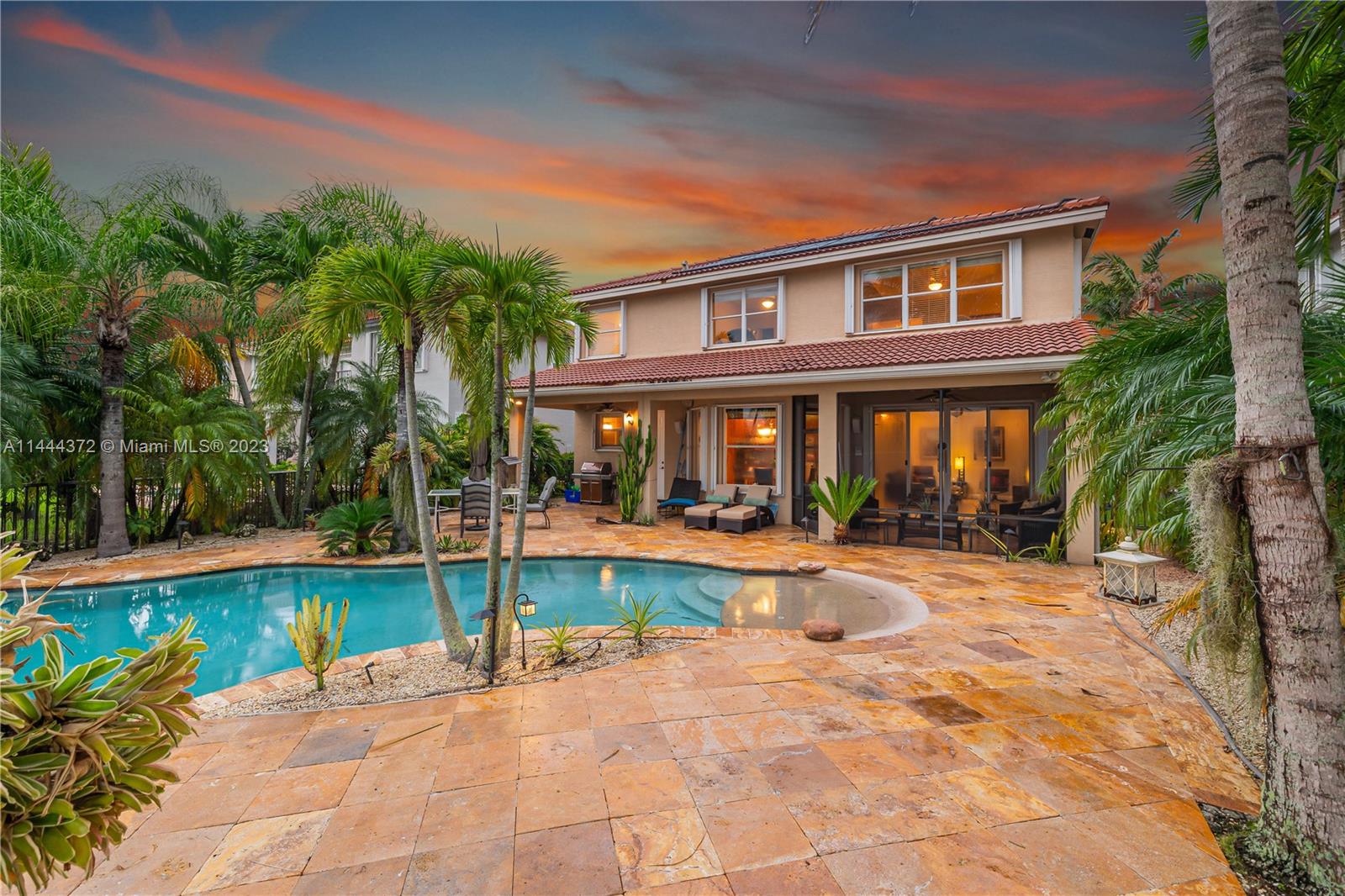 4546 Southwest 179th Way Miramar, FL 33029 - Photo 45 of 55 a front view of a house with swimming pool having outdoor seating