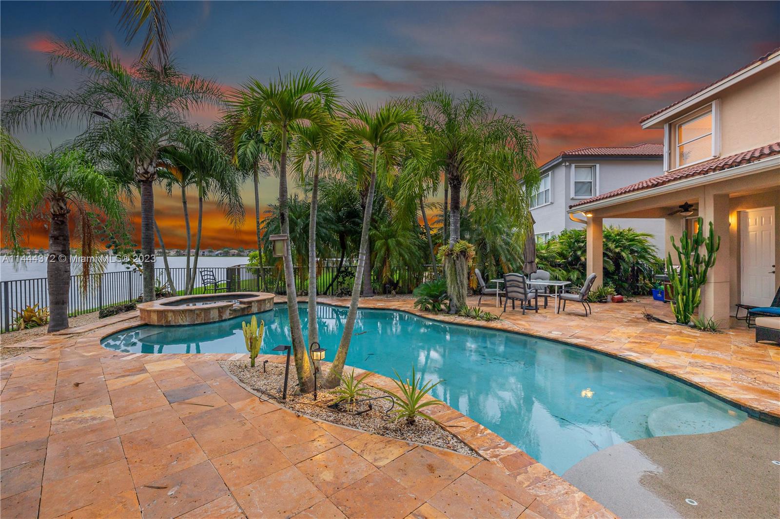 4546 Southwest 179th Way Miramar, FL 33029 - Photo 46 of 55 a view of a swimming pool with a patio