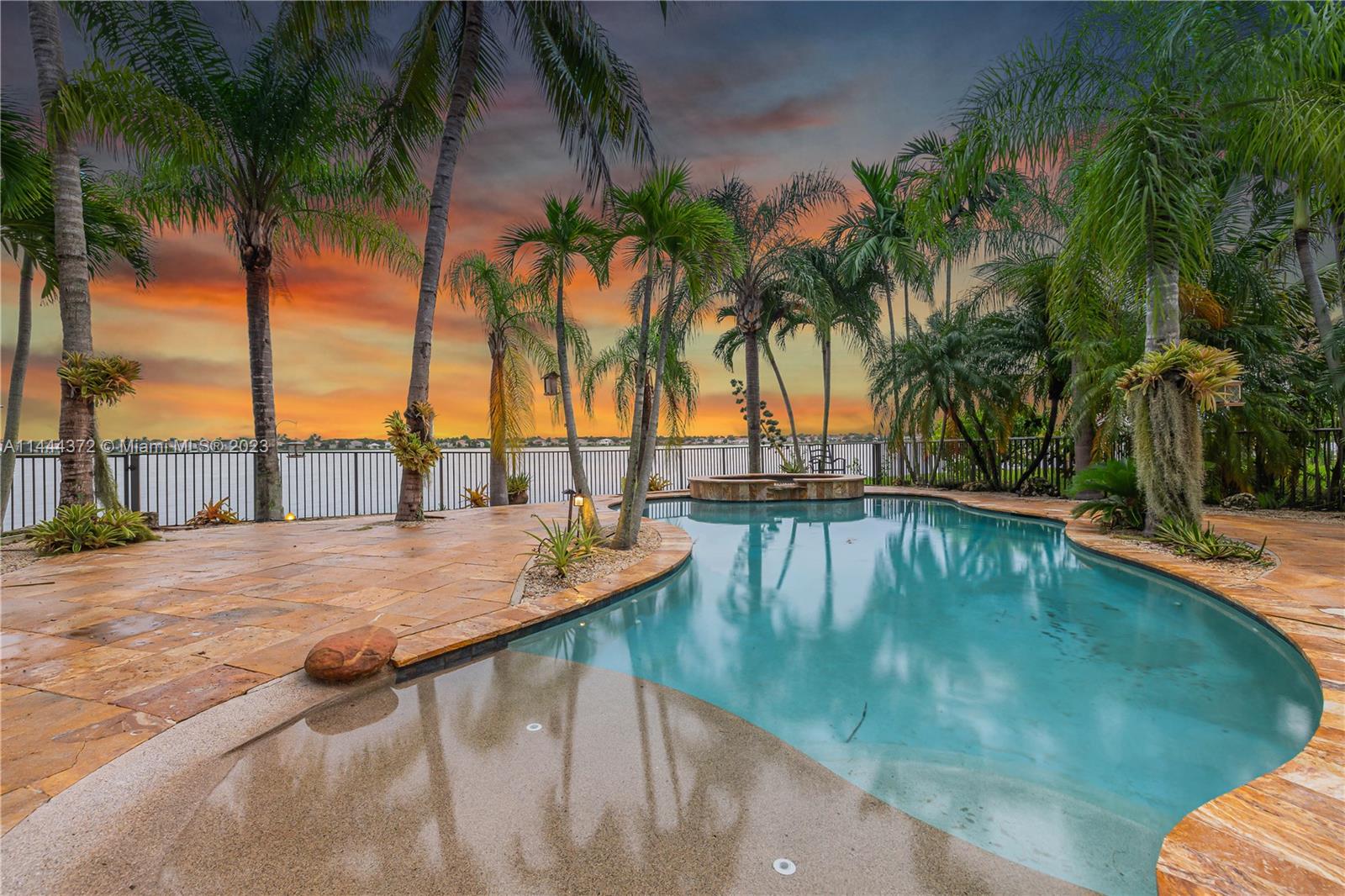 4546 Southwest 179th Way Miramar, FL 33029 - Photo 48 of 55 a view of swimming pool with a table and chairs