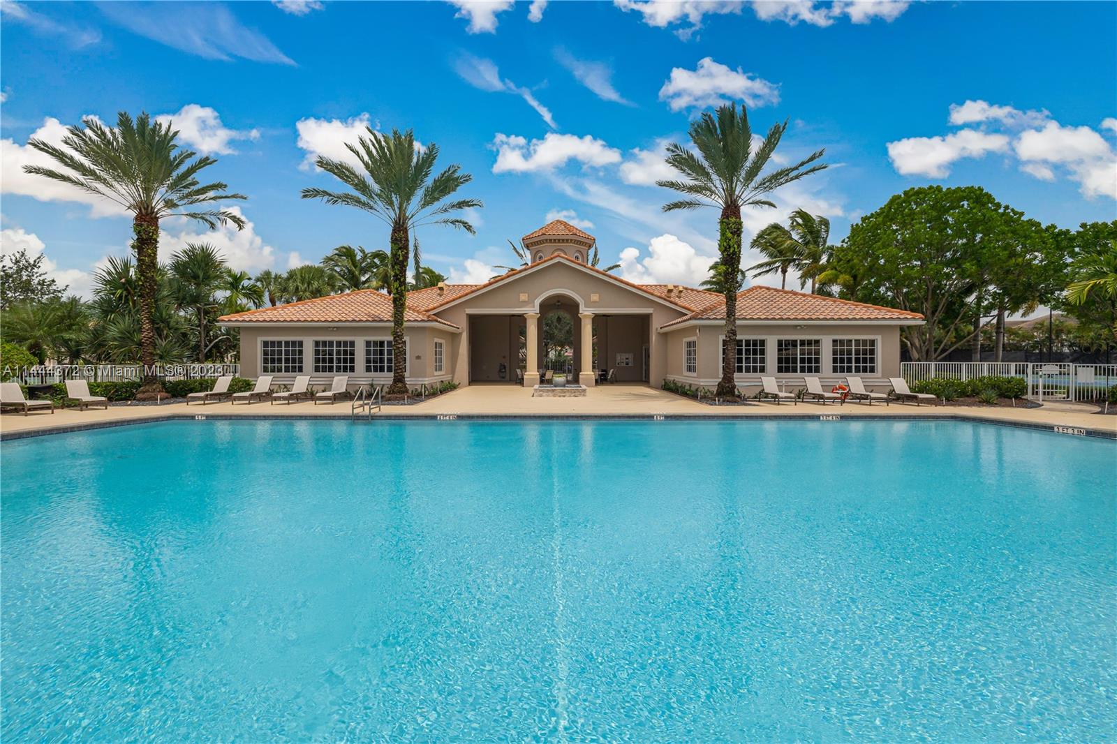 4546 Southwest 179th Way Miramar, FL 33029 - Photo 53 of 55 a front view of a house with a garden and lake view