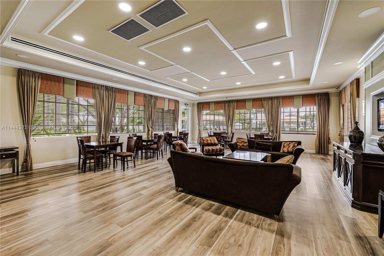 4546 Southwest 179th Way Miramar, FL 33029 - Photo 55 of 55 a living room with furniture a large window and wooden floor