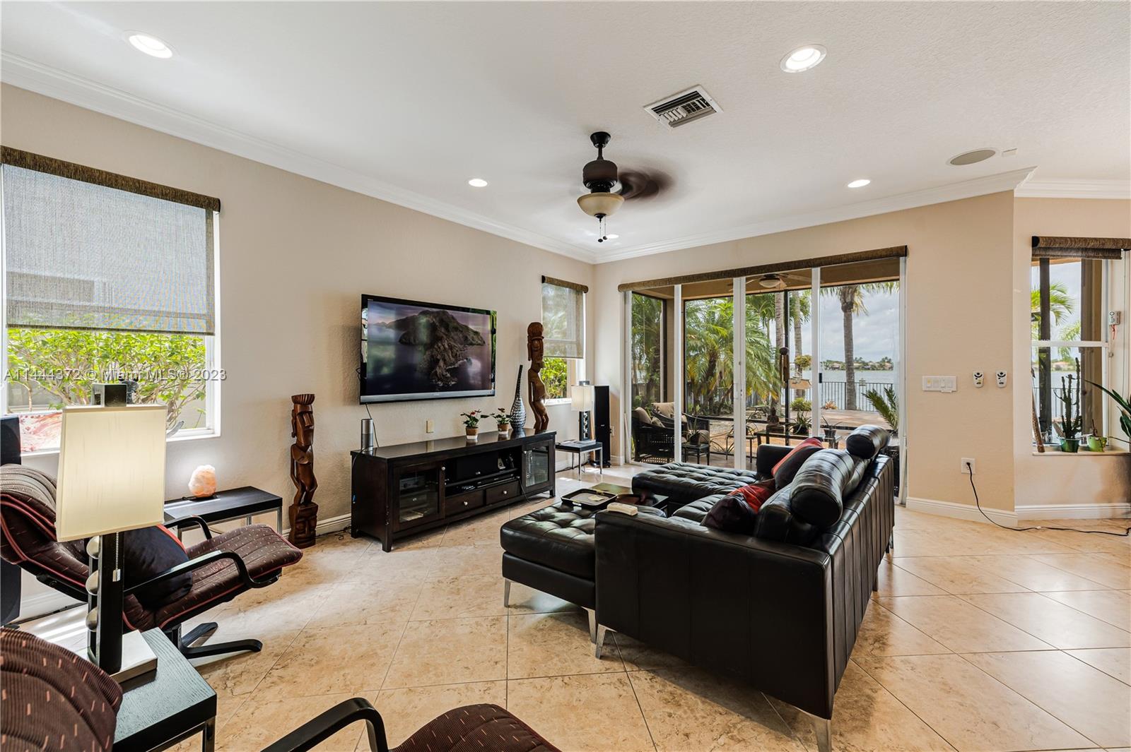 4546 Southwest 179th Way Miramar, FL 33029 - Photo 10 of 55 a living room with furniture and a flat screen tv