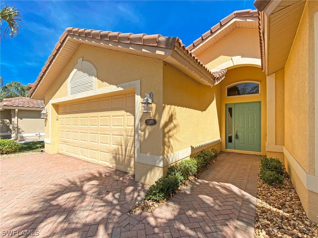 20599 Ardore Lane Estero, FL 33928 - Photo 2 of 29 a view of a back yard of the house