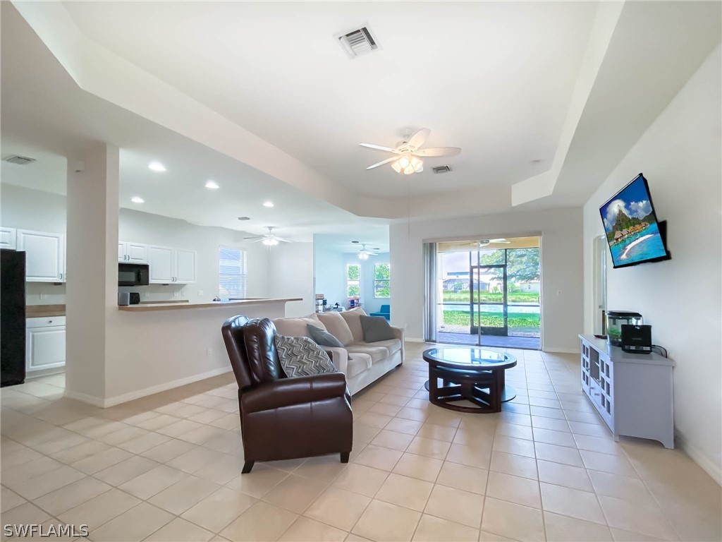 20599 Ardore Lane Estero, FL 33928 - Photo 3 of 29 a living room with furniture and a large window