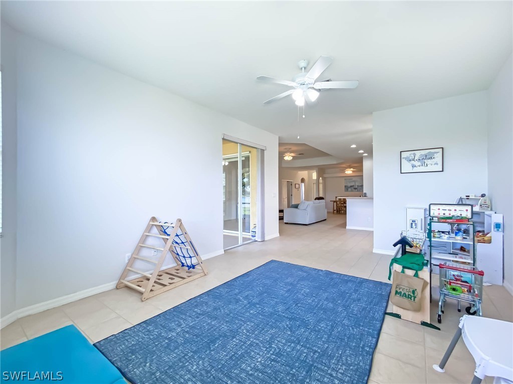 20599 Ardore Lane Estero, FL 33928 - Photo 9 of 29 a living room with furniture and a rug