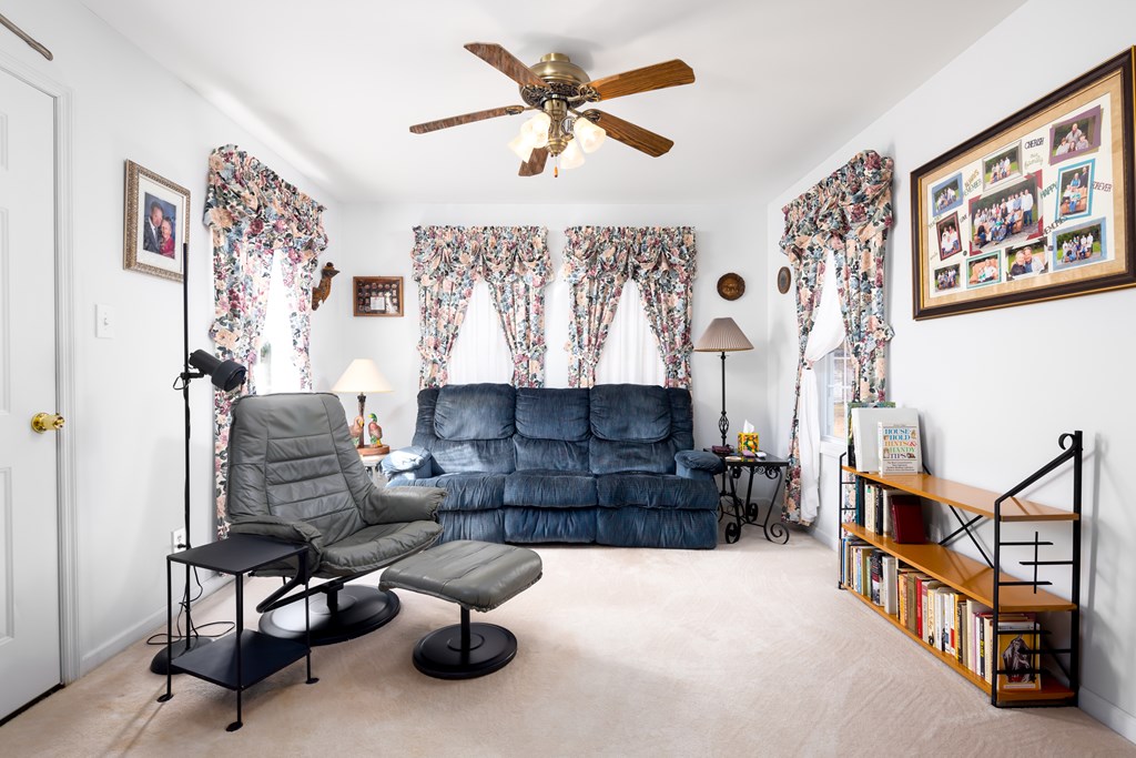 29 Bon Acre Road Fort Mitchell, AL 36856 - Photo 24 of 38 a living room with furniture and a chandelier
