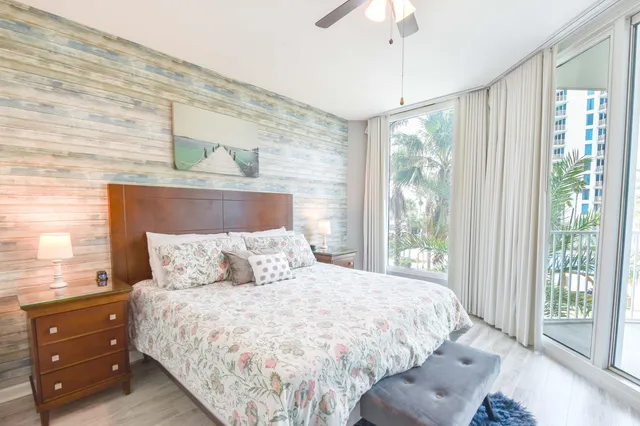 a bedroom with a large bed and a window