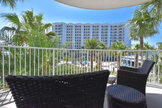 a view of a balcony with lake view and a potted plant