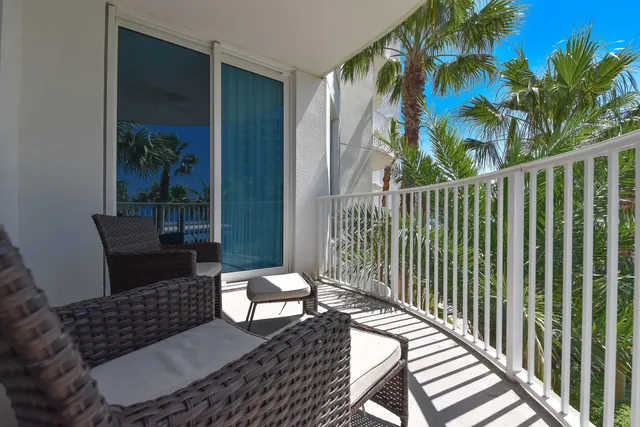 a view of a balcony with wooden floor