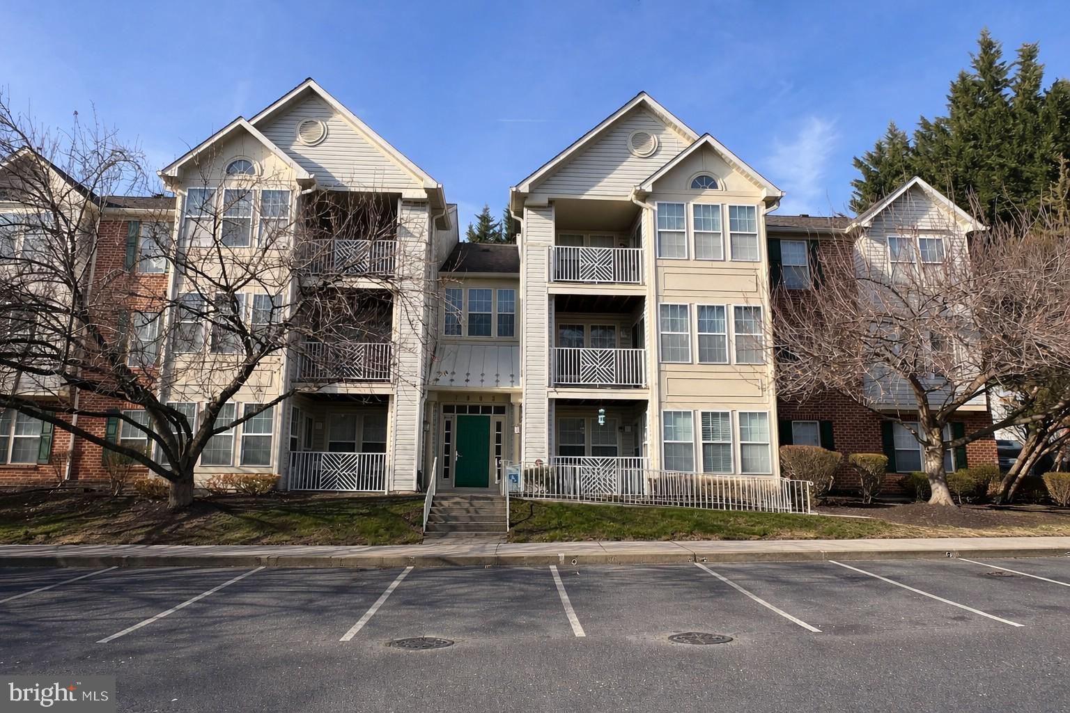 7903 Valley Manor Road, Unit 204 Owings Mills, MD 21117 - Photo 1 of 18 a front view of a building