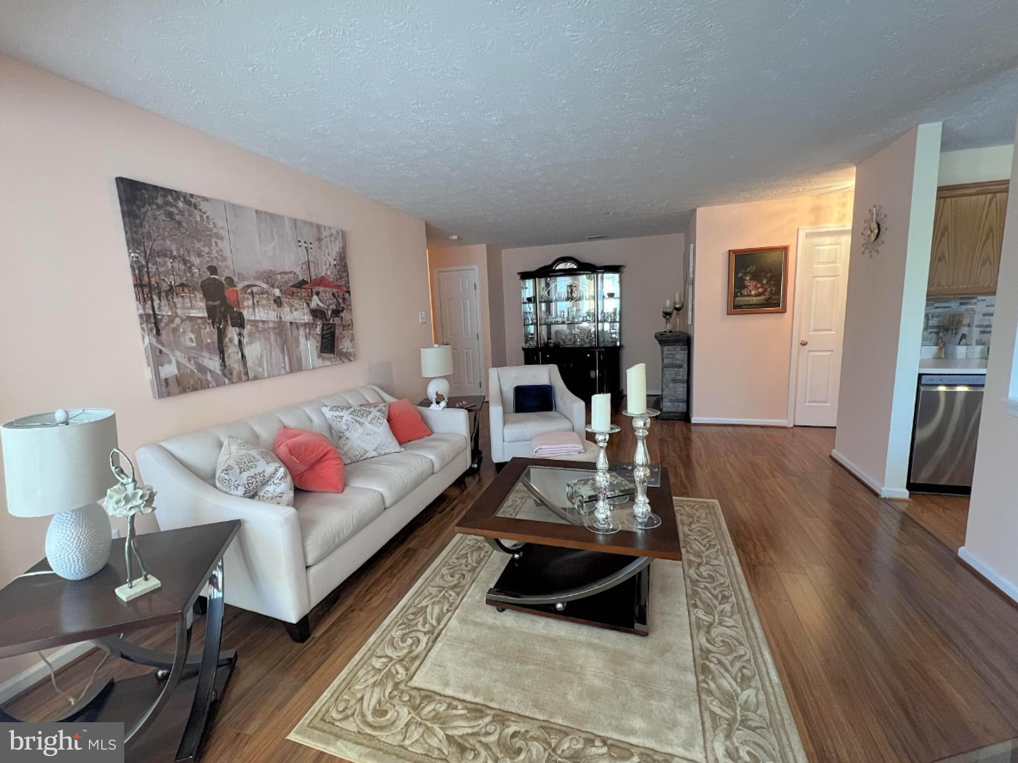 7903 Valley Manor Road, Unit 204 Owings Mills, MD 21117 - Photo 8 of 18 a living room with furniture and wooden floor