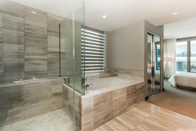a bathroom with a tub and shower